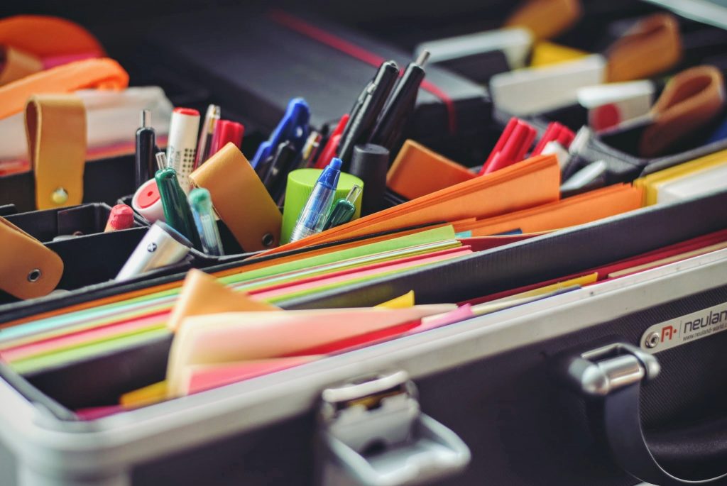 A desk organizer filled with colorful stationery