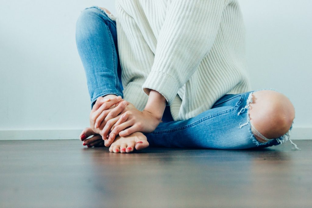 A person sitting on the florr