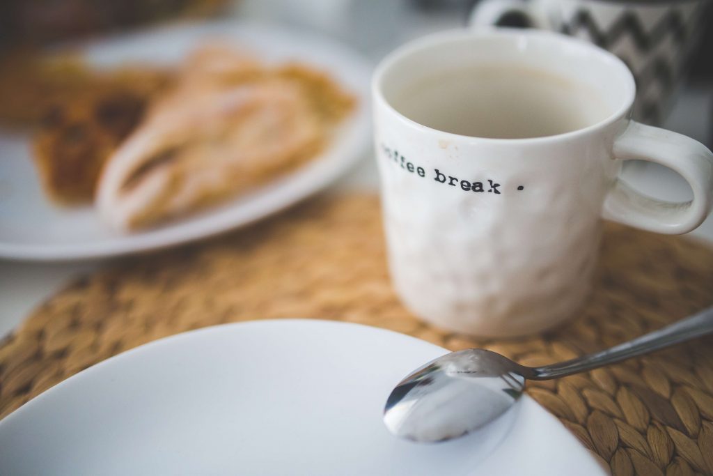 A mug suggesting to take a coffee break – reducing psychological impact of working from home