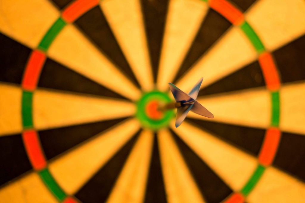 A dart hitting the target