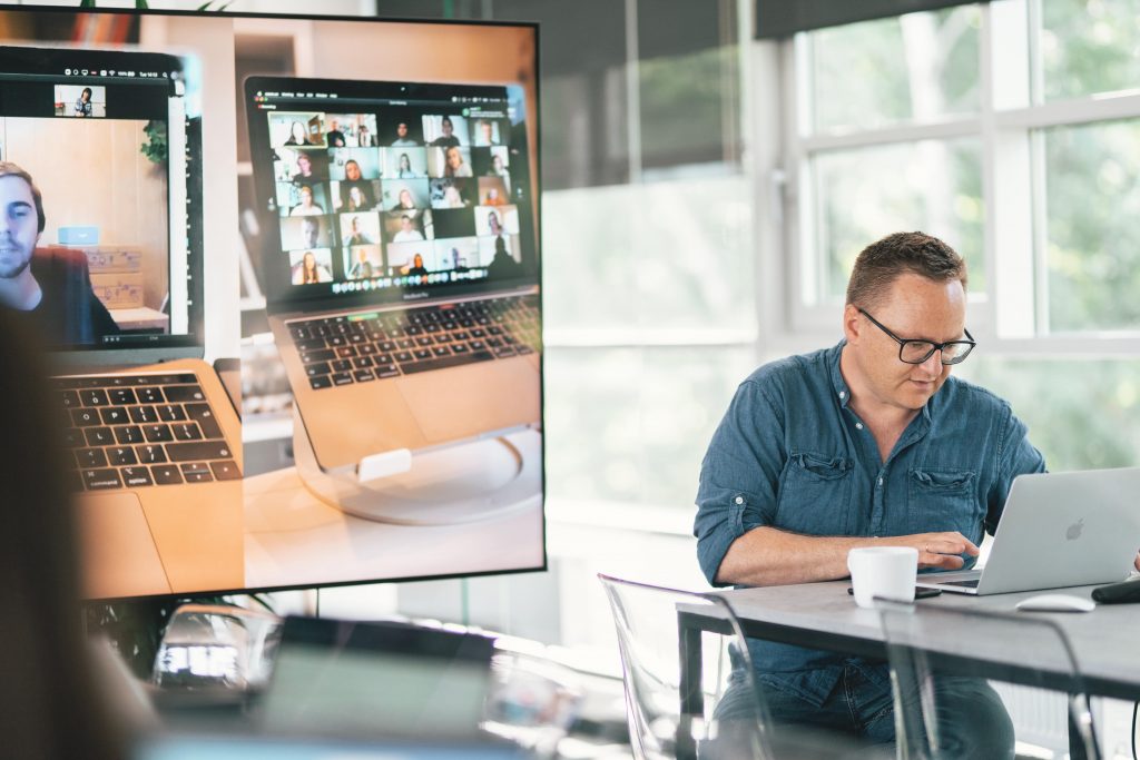 Man doing asynchronous work with multiple tools