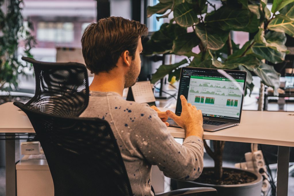 Man using DeskTime to check productivity levels during asynchronous work day