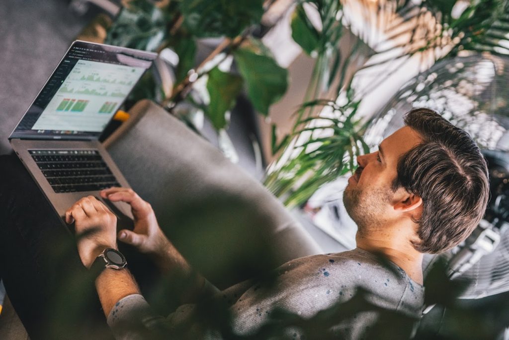 A man is using the DeskTime volunteer hour tracker