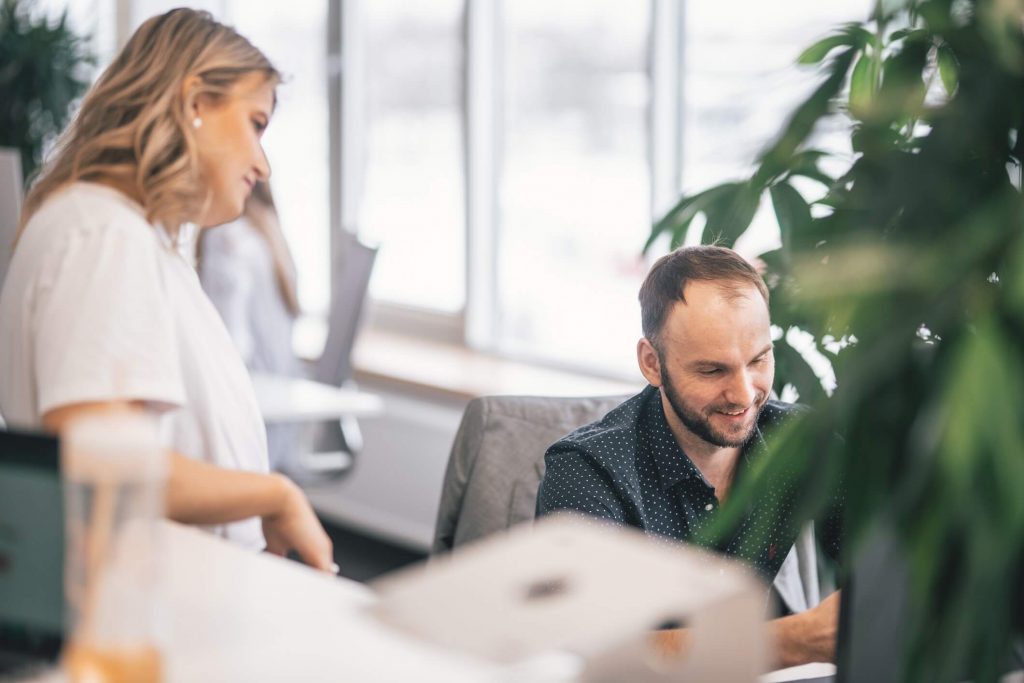 Two workers talking at the office