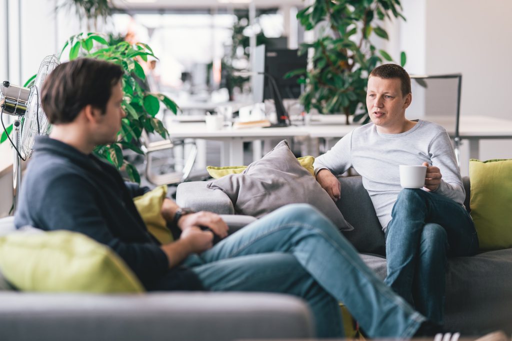 Two men in the office discussing how to deal with difficult clients