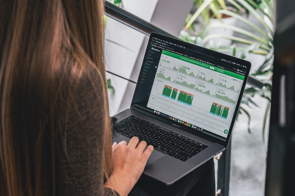 A woman using desktime app on the laptop to avoid dealing with difficult clients