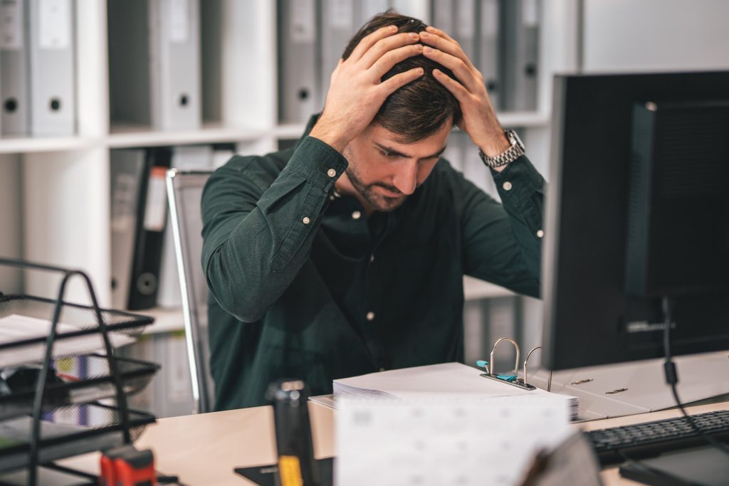 A man holding his head