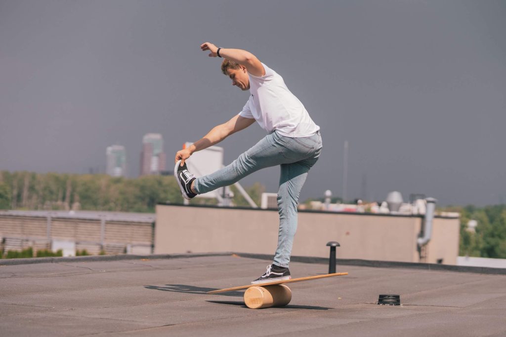 A man on a balancing board
