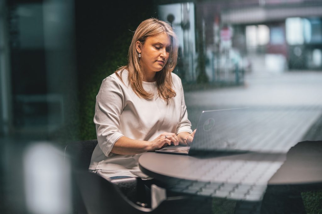 a woman sitting in a booth