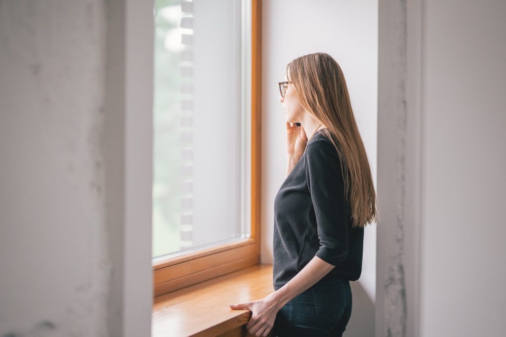 A woman looking out the window