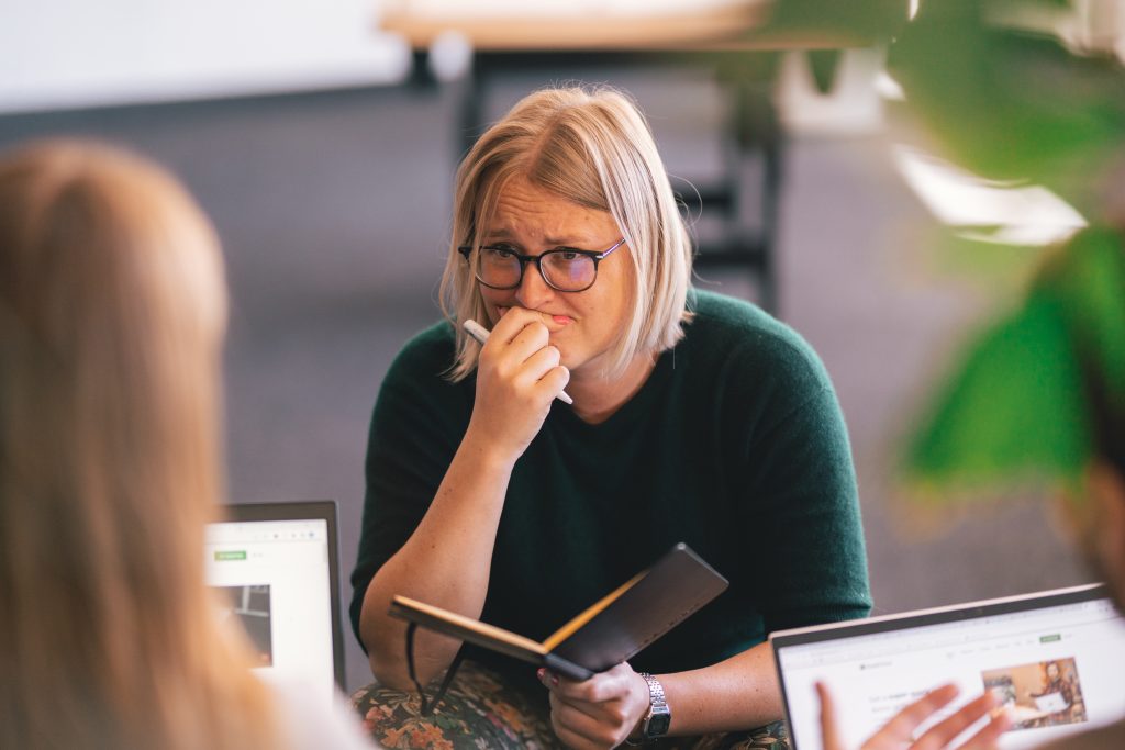 woman worried about being affected by metaverse workplace VR sickness