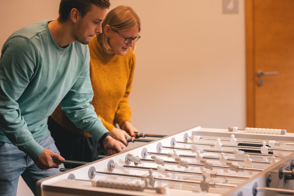 playing table football in the office