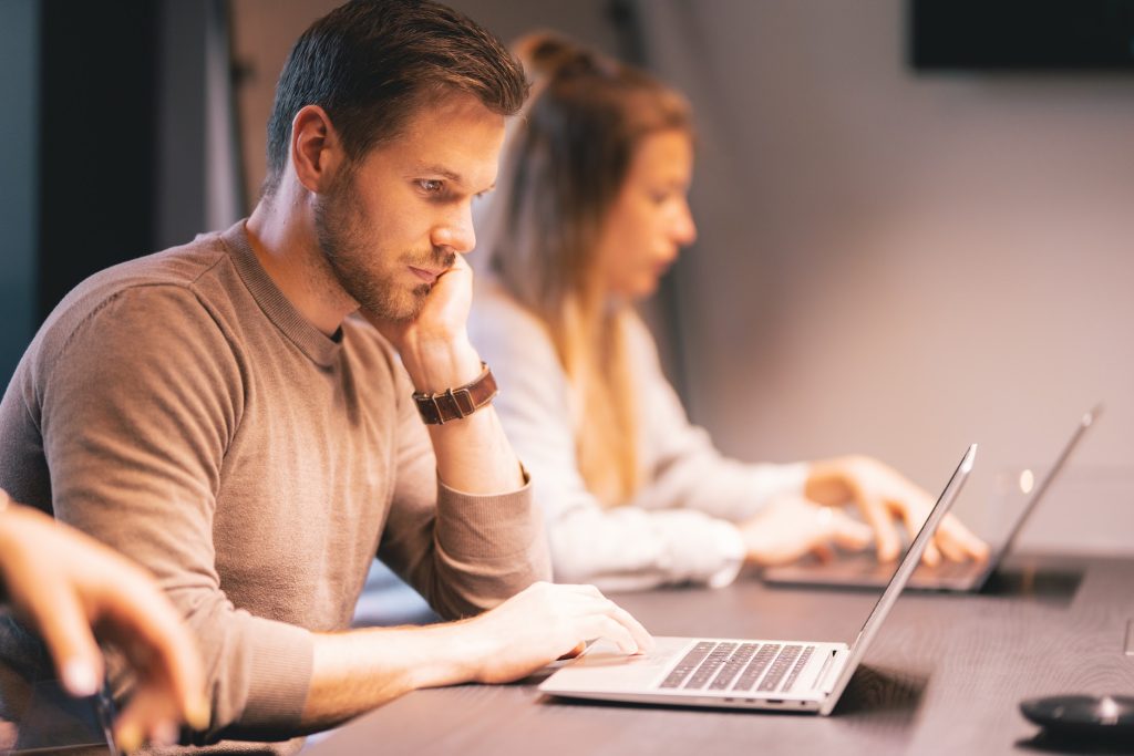 A man using laptop at work