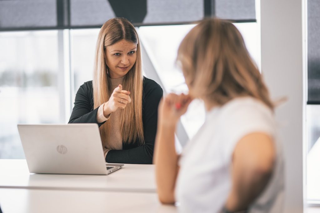 Two women discussing full-time versus part-time employment options