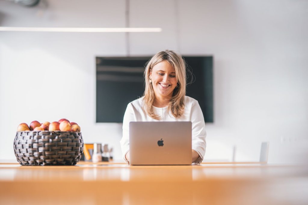 Woman that follows remote work rules and participates in video meeting with camera on