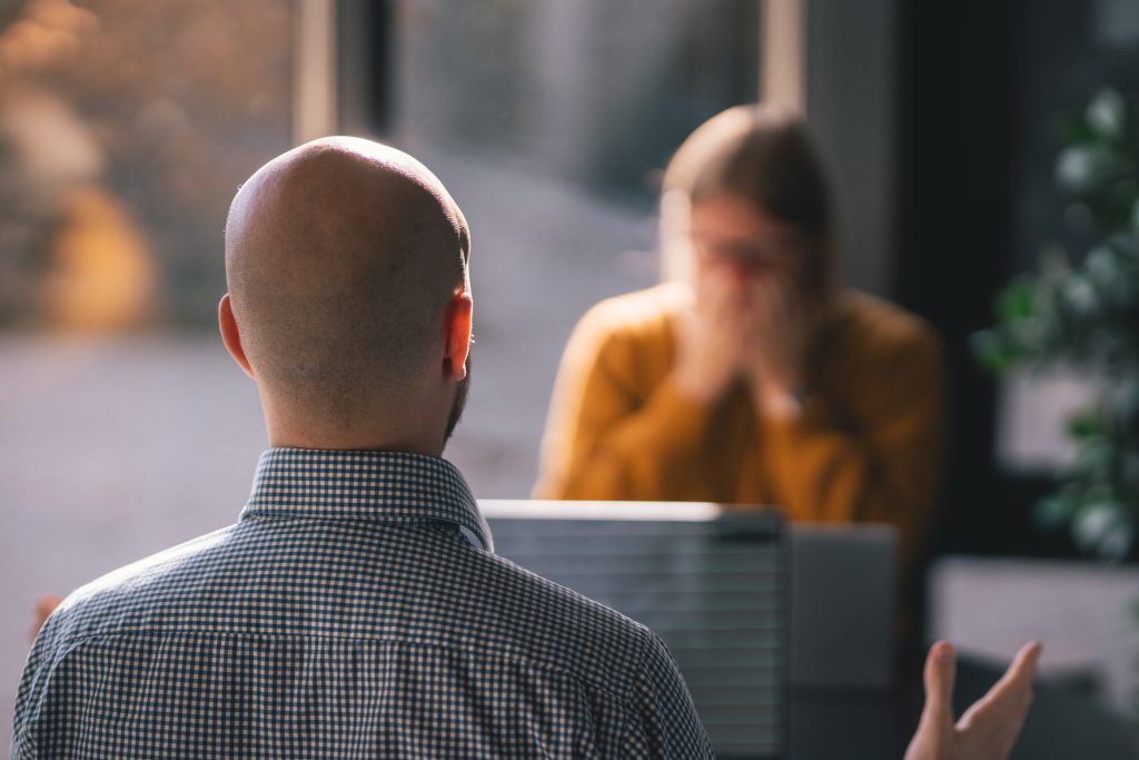 Man engaging in conflict management in virtual teams