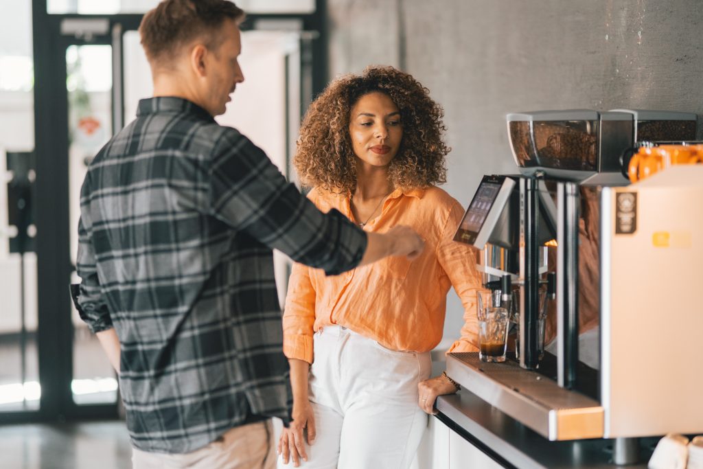 man telling woman how to drink coffee effectively