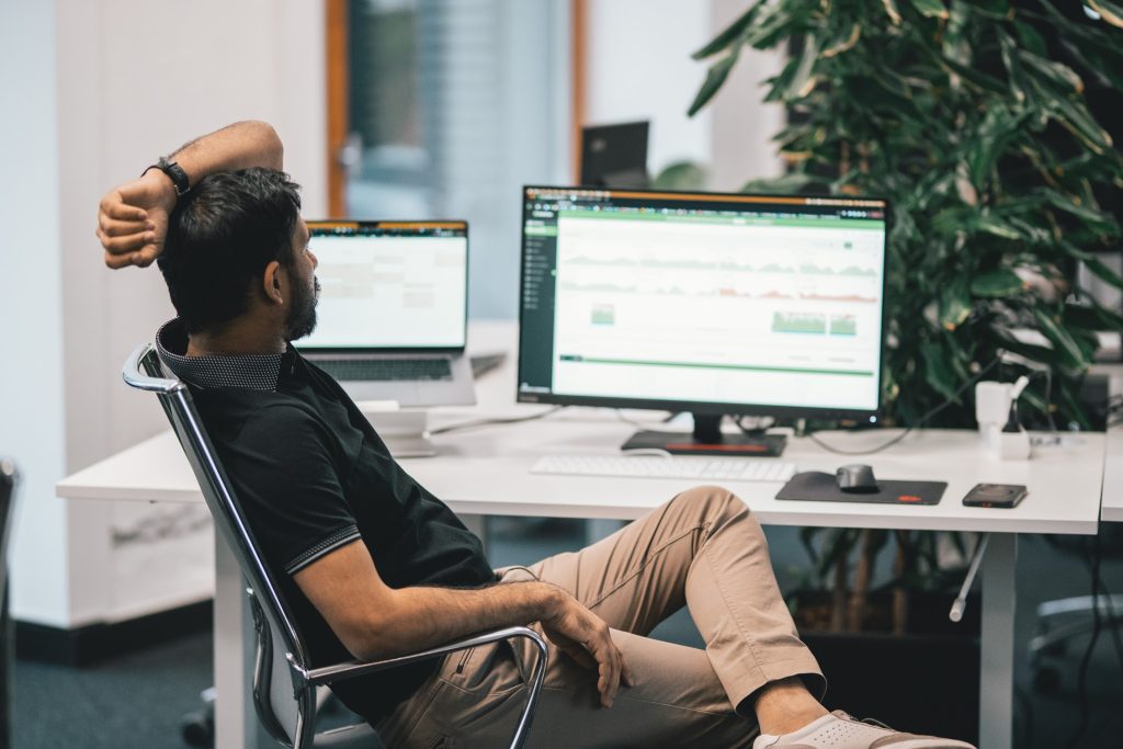 an office worker looking at DeskTime app open on his computer