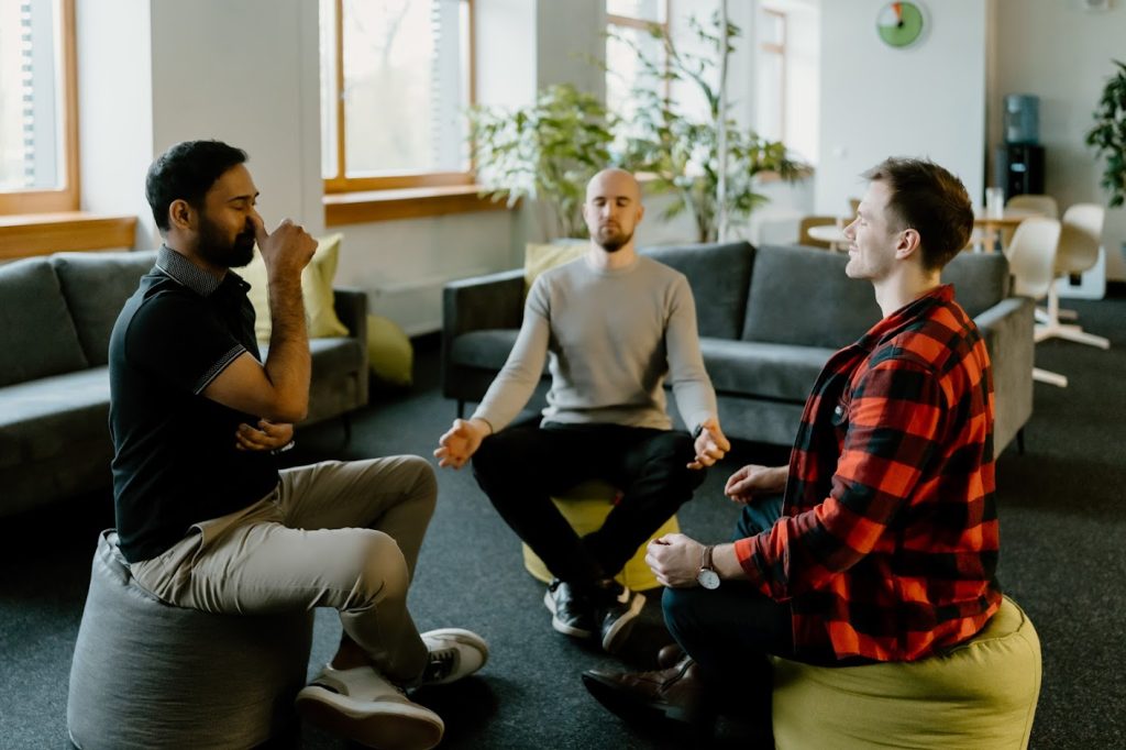 People meditating in the office