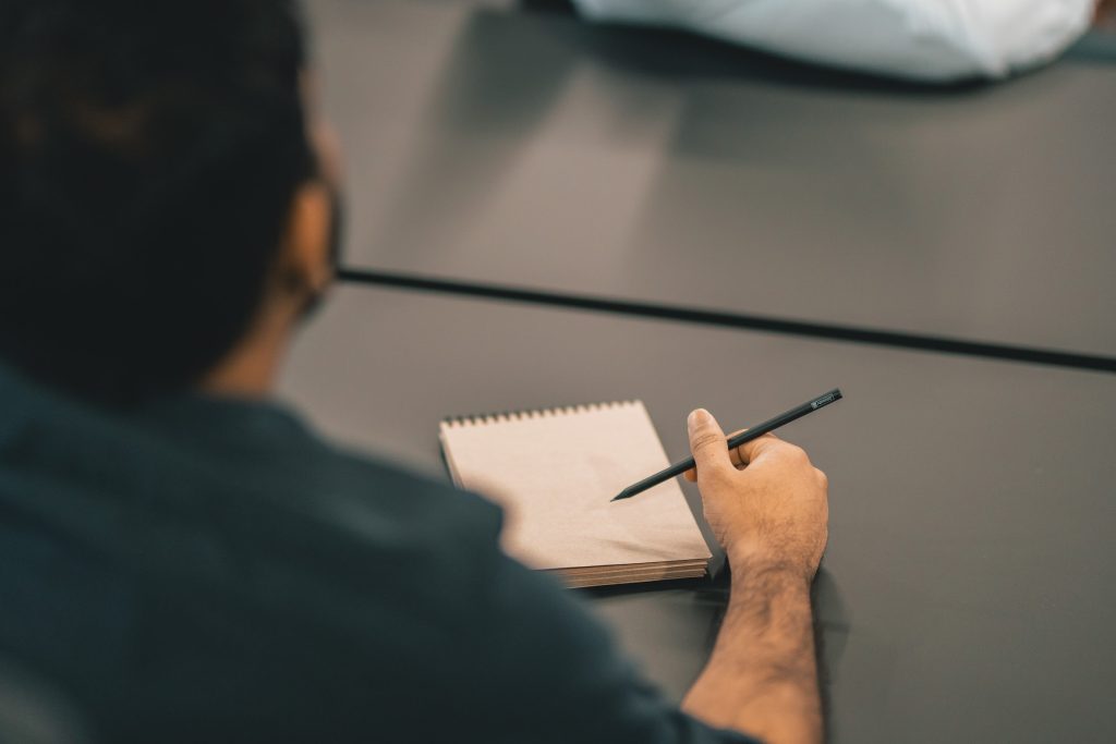man taking notes