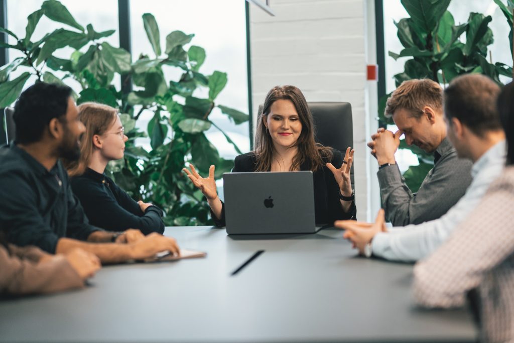 A woman running a meeting in the office