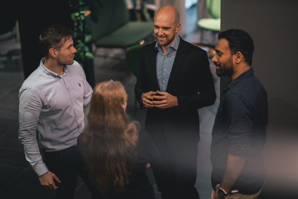 team discussing holiday party ideas for the office