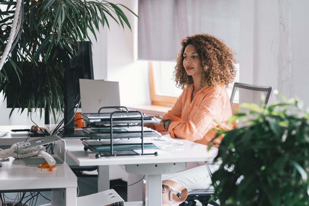 woman organizing her work desk and digital space