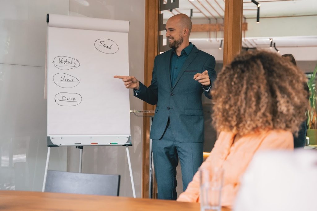 man discussing employee productivity metrics with woman