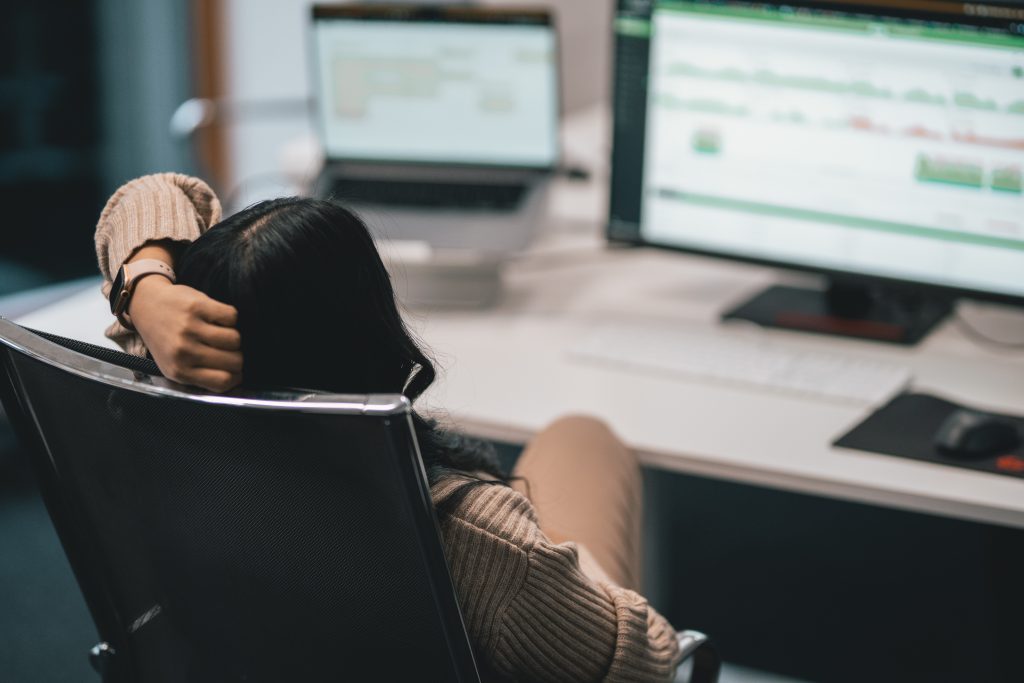 woman pondering the ai workslop workplace phenomenon