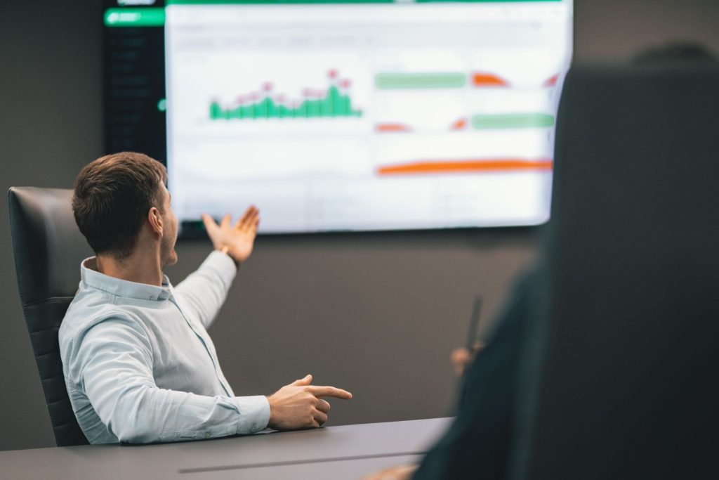 Man pointing at AI time tracking results