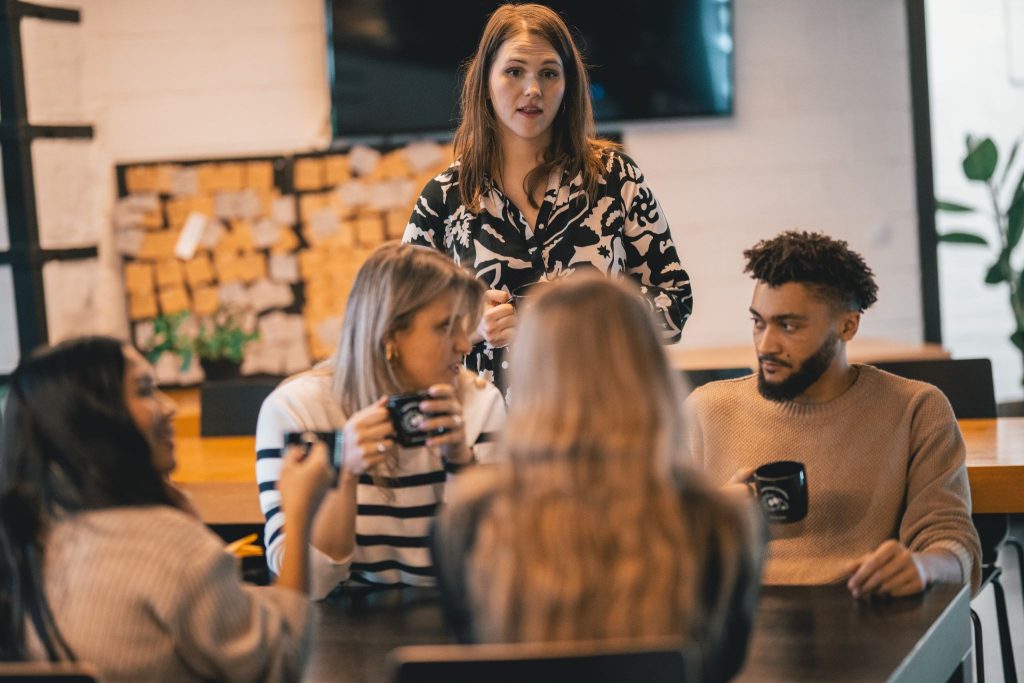 A diverse team discussing how to use ai to work more efficiently