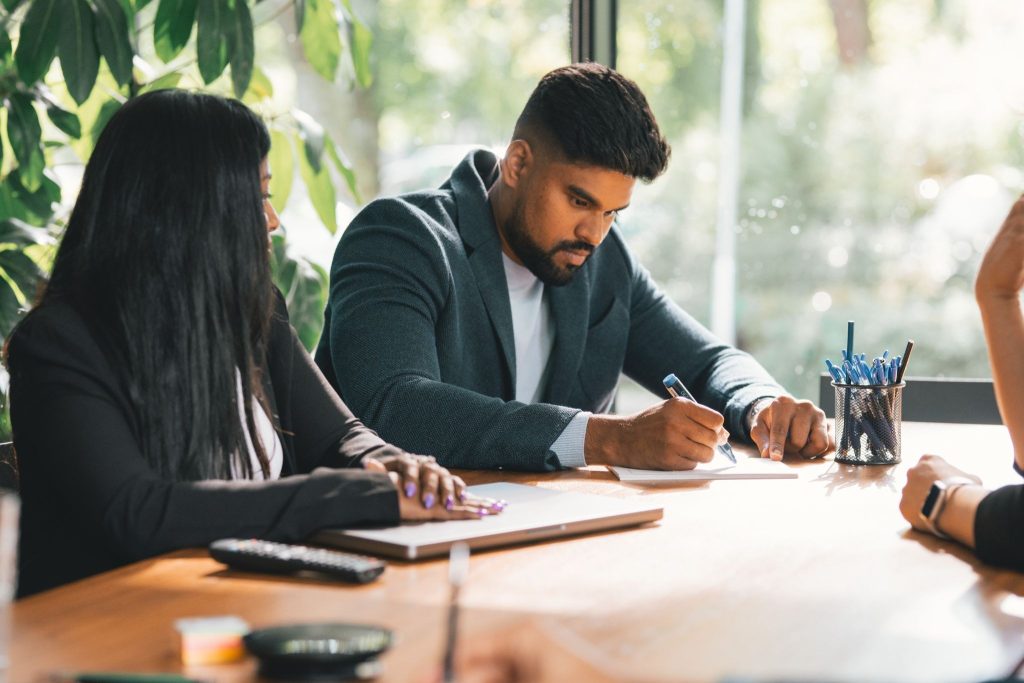 Man writing down productivity fundamentals