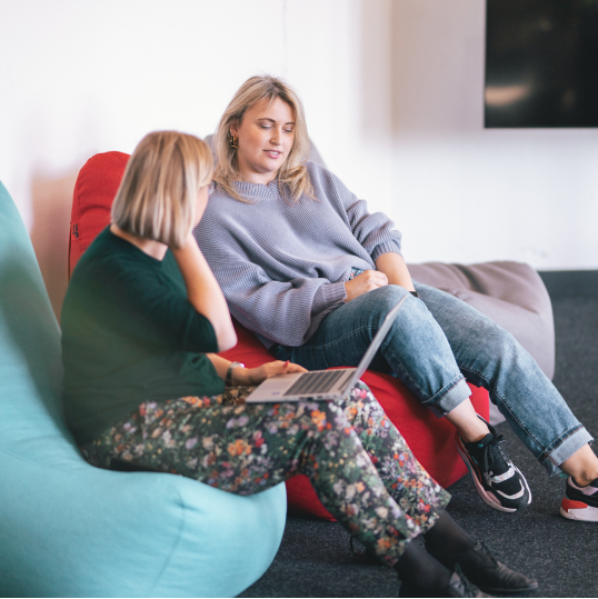 An image of two women in a meeting